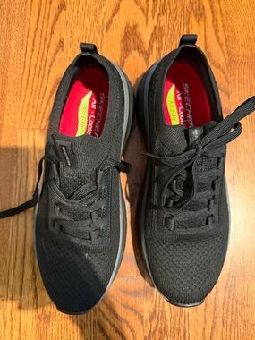 Skechers women’s  Black Knit Slip-On Athletic Sneakers with Red Insoles